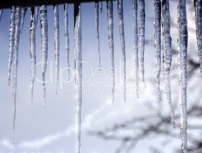 Long icicles on the roof at the end of winter.