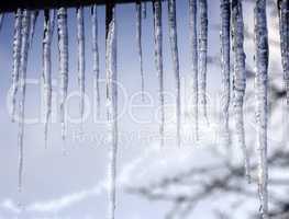 Long icicles on the roof at the end of winter.