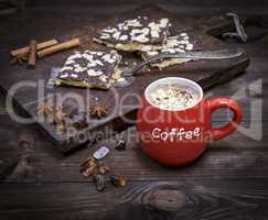 red ceramic mug with coffee and marshmallows