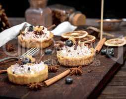 cakes with white cream and sprinkled with chocolate