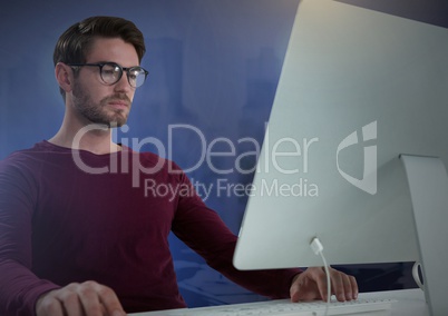 Businessman working on laptop with purple background