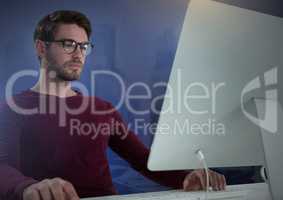 Businessman working on laptop with purple background