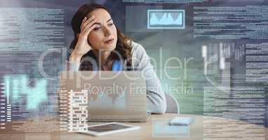 Businesswoman working on laptop with screen text interface