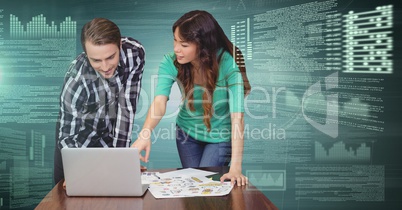 Business couple working on laptop with screen text interface