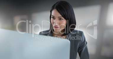 Businesswoman working on laptop