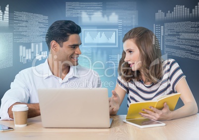 Business couple working on laptop with screen text interface