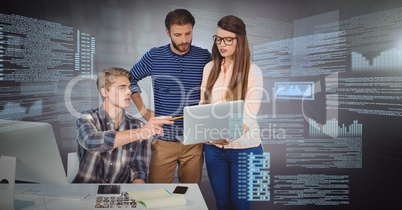 Three people working on laptop with screen text interface