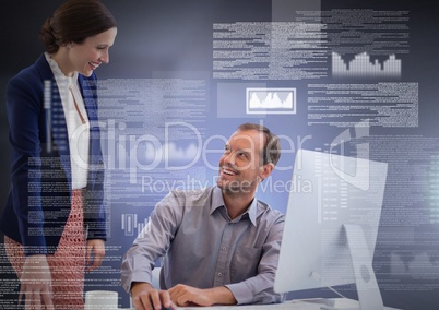 Business couple working on laptop with screen text interface