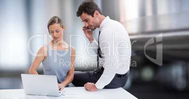 Business couple working on laptop