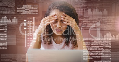 Woman working on laptop with screen text interface