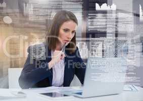 Businesswoman working on laptop with screen text interface