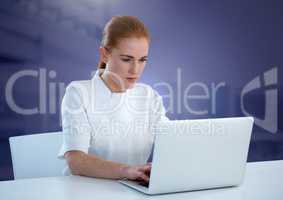 Businesswoman working on laptop with purple background