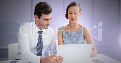 Business couple working on laptop