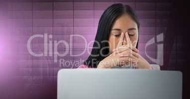 Businesswoman working on laptop with pink window background