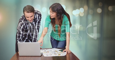 Business couple working on laptop