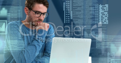 Businessman working on laptop with screen text interface