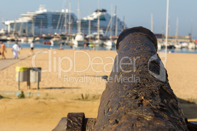Old cannon on the promenade near the harbor in Palamos