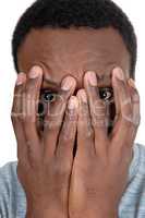 African man holding his hands over face
