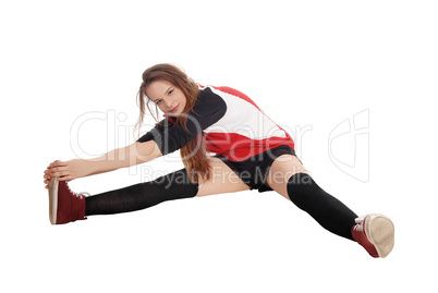 Young woman doing gymnastics on floor