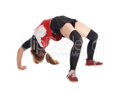 Young woman making a bridge on the floor