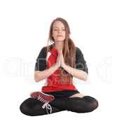 Beautiful woman sitting in joga pose