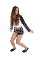 Woman dancing in checkered shorts