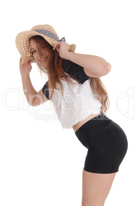 Beautiful woman with a hat and black shorts