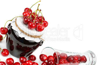 Cherries and jars of jam isolated on white background. Free spac