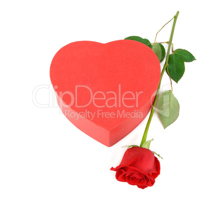 Gift box in the form of heart and scarlet rose isolated on white