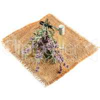 Flowers and lavender oil isolated on white background.