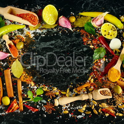 Variety of spices and herb on kitchen table.