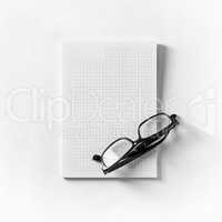 Glasses and copybook
