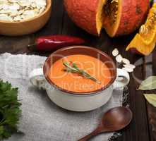 fresh pumpkin soup in a ceramic plate