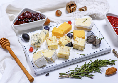 small pieces of brie cheese, roquefort, camembert, cheddar and c