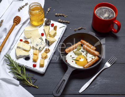 cheese and a round cast-iron frying pan with fried egg