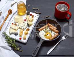 cheese and a round cast-iron frying pan with fried egg