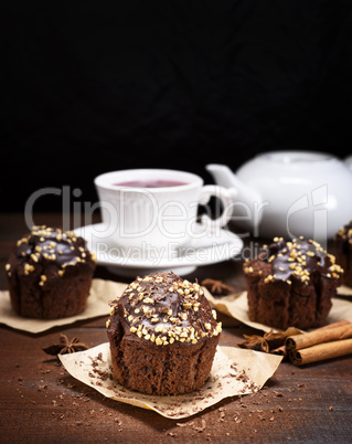 chocolate muffin sprinkled with nuts