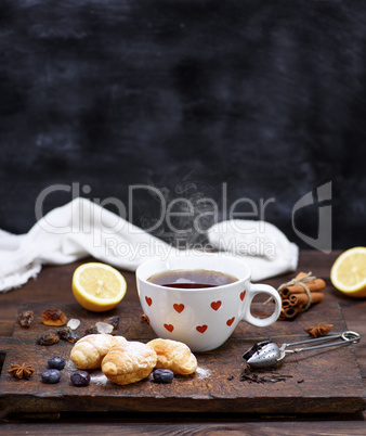 white ceramic mug with black hot tea