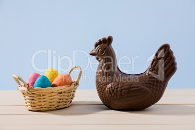 Easter chocolate chicken and eggs over a table