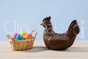 Easter chocolate chicken and eggs over a table