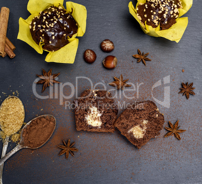 chocolate cake in yellow paper on a black background