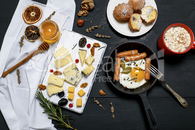 fried egg with sausages and cheese board