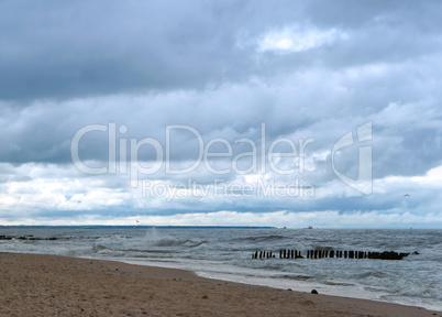 sea wave, storm at sea, waves lapping on the shore, cargo ship at sea