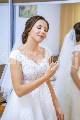 Bride getting ready for the wedding in the morning.