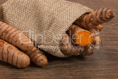 stack of turmeric on grunge wooden background