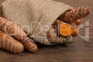 stack of turmeric on grunge wooden background