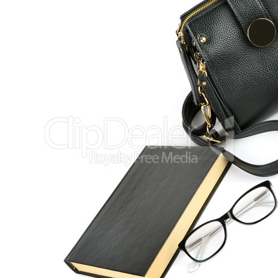 Bag, glasses and book isolated on white background. Free space f