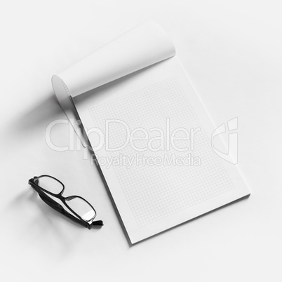 Copybook and glasses