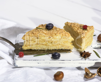 two baked cakes Napoleon with cream