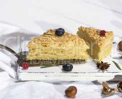 two baked cakes Napoleon with cream